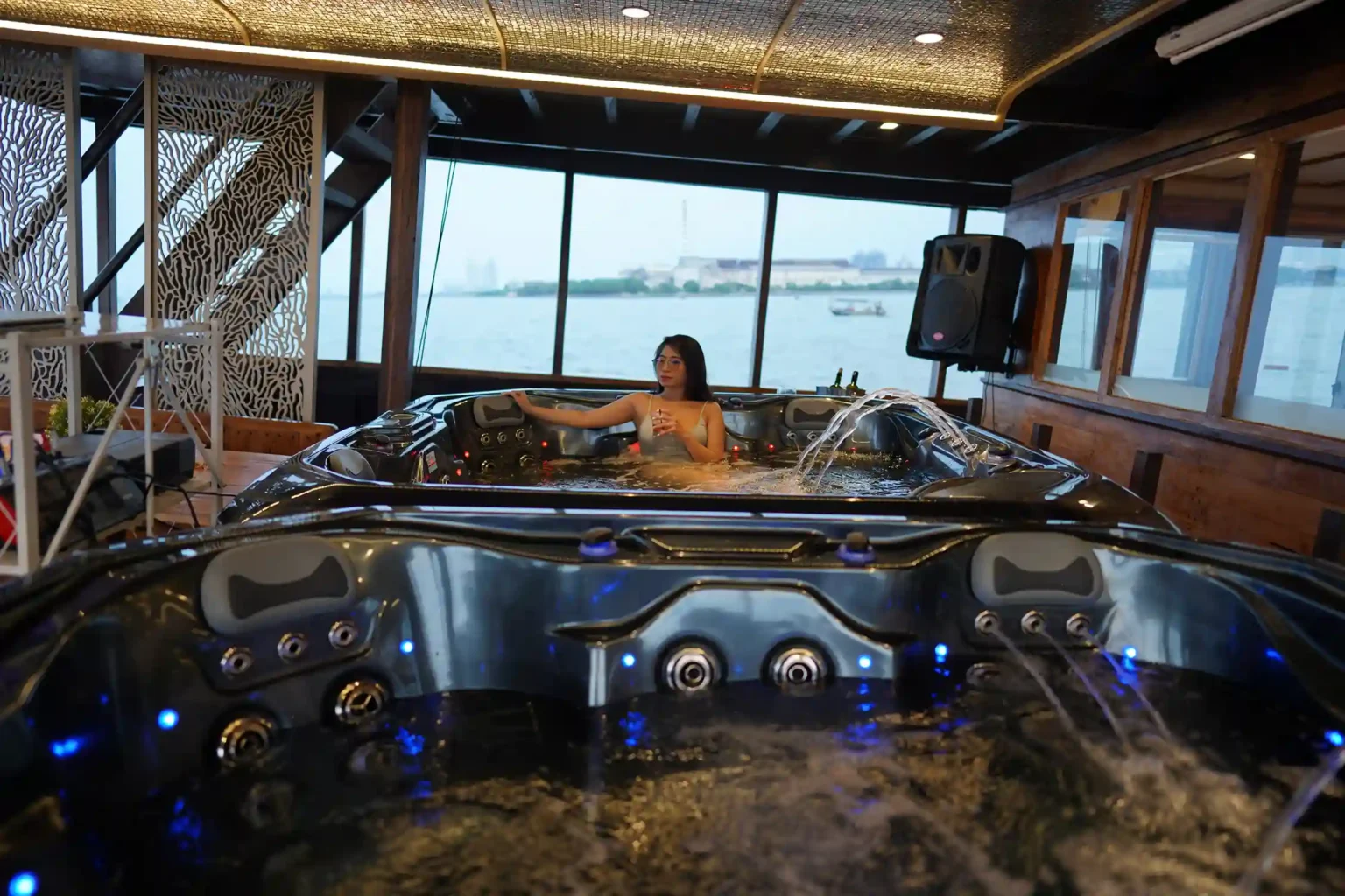 Guests on the aft deck of a yacht at sunset