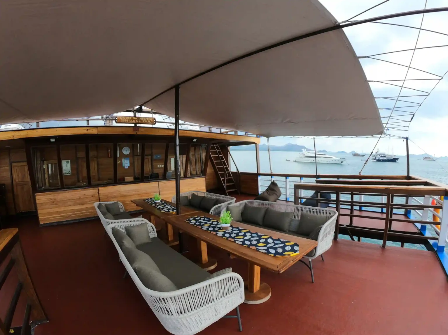 Tender running guests out to yachts off the Sanur roadstead